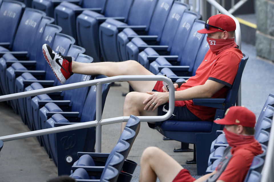 Washington Nationals' Stephen Strasburg (37) watches from the stands during the first inning of a baseball game against the Toronto Blue Jays, Tuesday, July 28, 2020, in Washington. (AP Photo/Nick Wass)