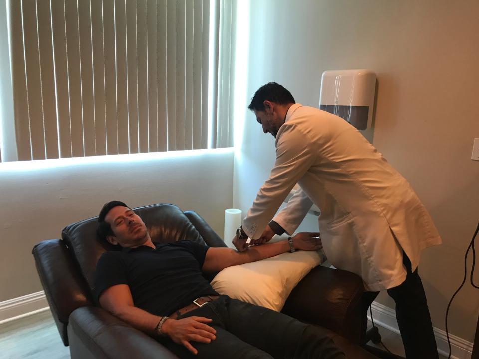Dr. Mahjoubi with client Jorge Perez @jorgeperezjr preparing for a ketamine infusion session.