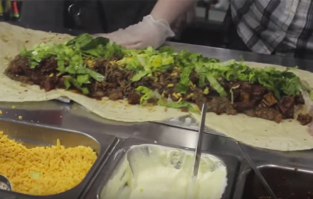 The 'Belly Buster Burrito' in the making. Photo: YouTube