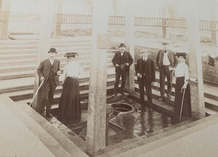 An archive photograph provided by the French Lick resort shows visitors to the Neptune Spring No. 5. Resort officials believe the spring dates back to the 1890s.