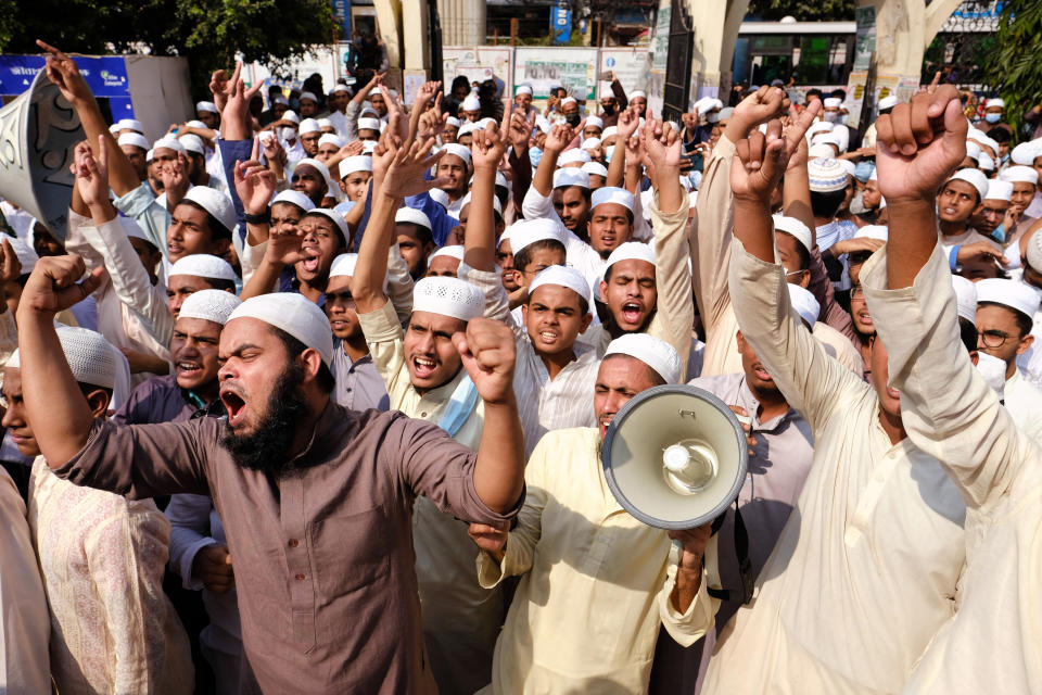 Supporters of Islami Oikya Jote, an Islamist political party, protest against French President Emmanuel Macron and against the publishing of caricatures of the Prophet Muhammad they deem blasphemous, in Dhaka, Bangladesh, Wednesday, Oct. 28, 2020. Muslims in the Middle East and beyond on Monday called for boycotts of French products and for protests over the caricatures, but Macron has vowed his country will not back down from its secular ideals and defense of free speech. Posters read "France is the enemy of humanity. World citizens fight back." second left, "Muslims of the world stand against insults to the prophet," third right and "Stop buying products from France. In the name of the Prophet," left. (AP Photo/Mahmud Hossain Opu)