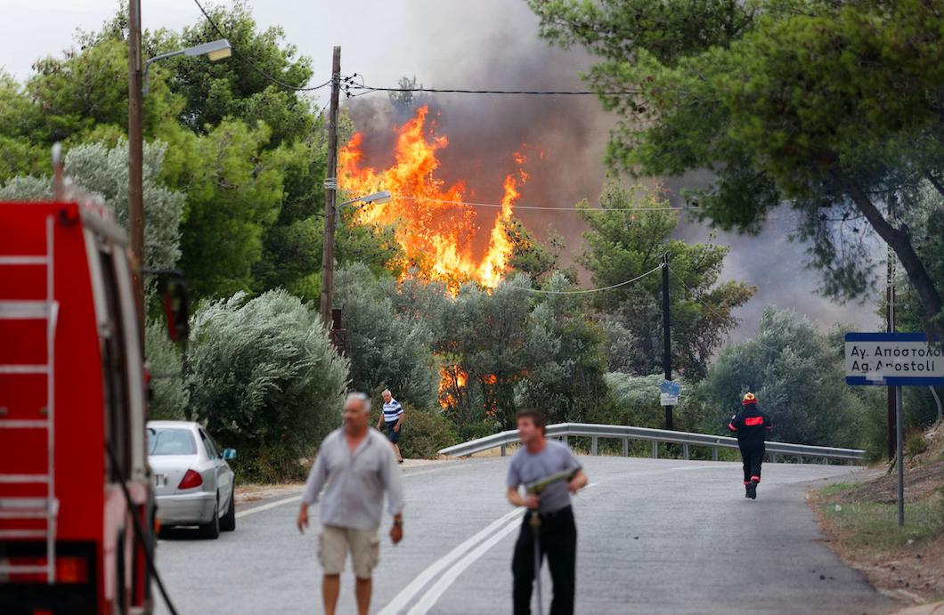<em>The heatwave is affecting other countries in Europe, including Greece, where wildfires have killed scores of people (Rex)</em>