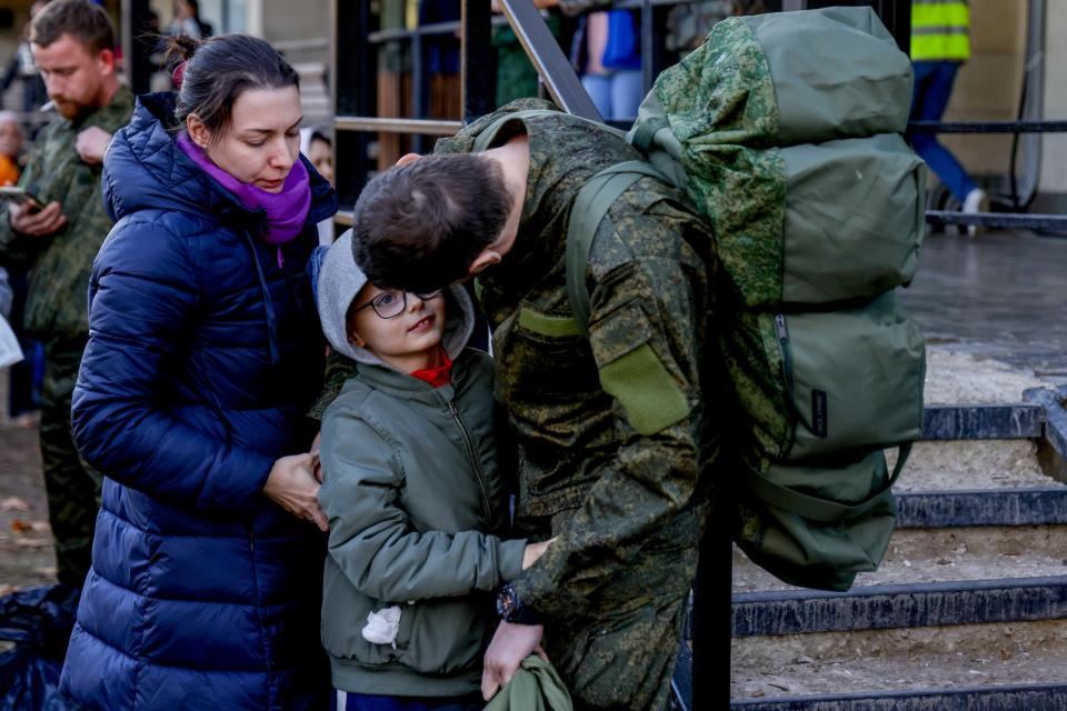 Russia troops soldiers family Moscow military recruiting office