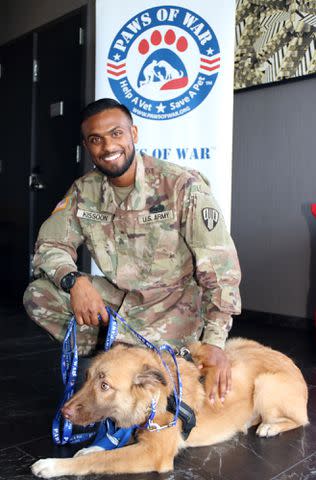 <p>Courtesy of Paws of War</p> Soldiers reunited with the stray animals they rescued while being deployed in the Middle East