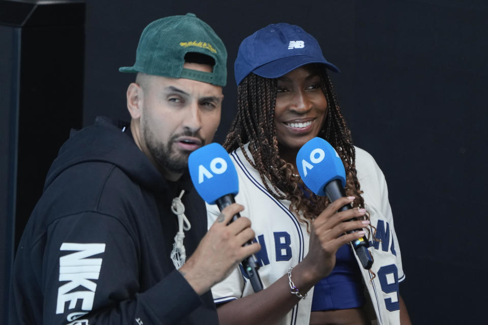 CORRECTS SPELLING TO KYRGIOS, INSTEAD OF KYRIGOS - Coco Gauff of the United States is interviewed by Australia's Nick Kyrgios, left, during a practice session ahead of the Australian Open tennis championships at Melbourne Park, Melbourne, Australia, Friday, Jan. 12, 2024. (AP Photo/Andy Wong)