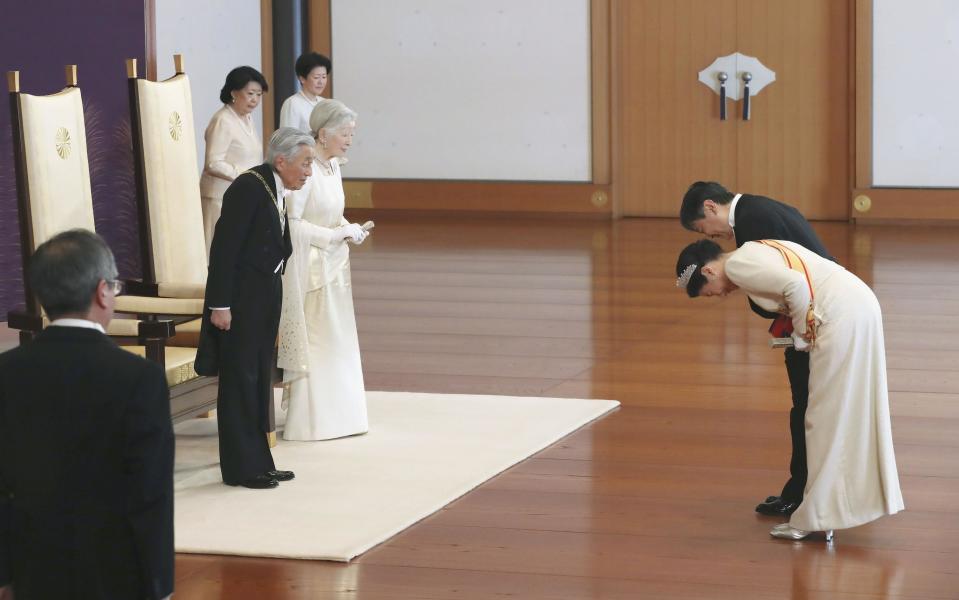 Japanese Emperor Akihito, second from left, and Empress Michiko, third from left, are greeted by Crown Prince Naruhito, right, and Crown Princess Masako, second from right, during a ceremony in the celebration of New Year at the Imperial Palace in Tokyo, Tuesday. Jan. 1, 2019. (Kyodo News via AP)
