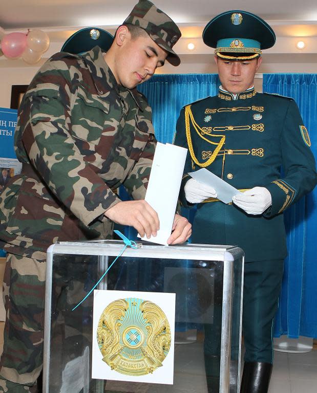 Kazakh election officials said turnout was a record 95.22 percent as these servicemen cast their ballot at a polling station in Astana, on April 26, 2015