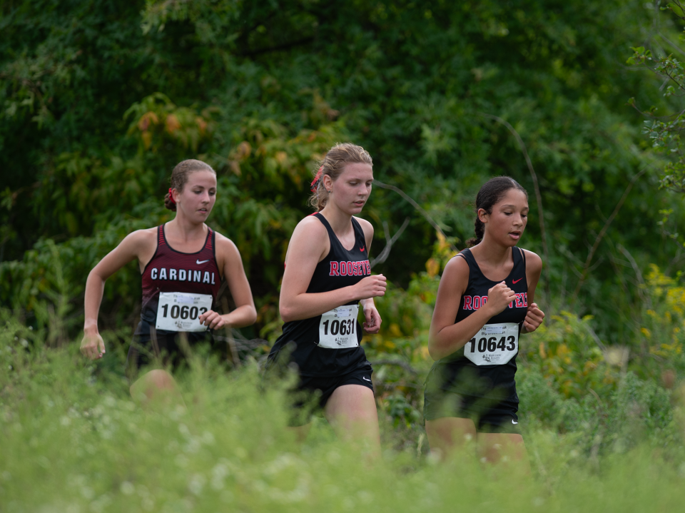 Kent Roosevelt runners Caroline Stahle West, 643, and Jeanie Barzellato, 631, finish fourth and sixth with Cardinal's Lily Ayer, 603, in the fifth spot at the Streetsboro Rockets XC Invitational on Saturday.