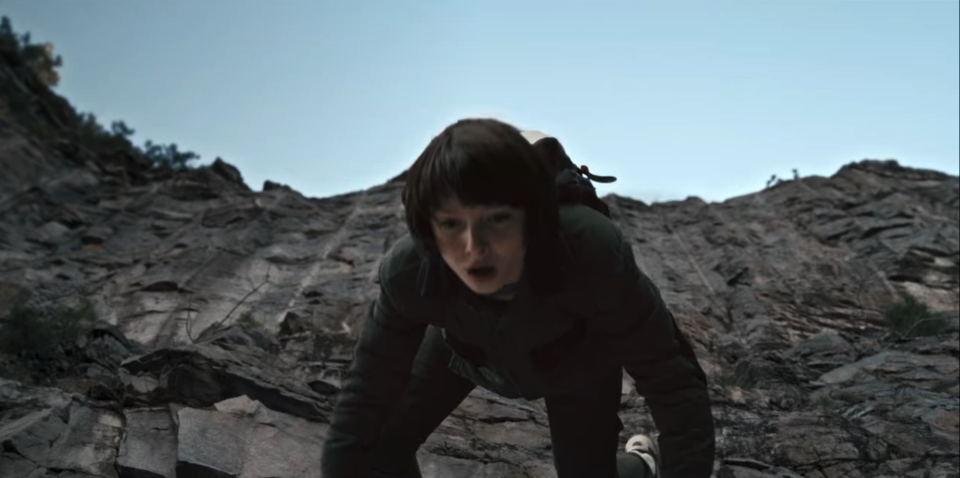 Mike Wheeler, played by Finn Wolfhard, jumps off a cliff in a scene from Season 1, Episode 6 of Netflix's "Stranger Things."