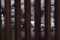 Houses in Tecate, Mexico are seen through a new section of border wall Thursday, Sept. 24, 2020, near Tecate, Calif. President Donald Trump’s reshaping of U.S. immigration policy may be most felt in his undoing of asylum. With immigration laws temporarily suspended at the border during the pandemic, people who enter the U.S. illegally are immediately “expelled” without even a piece of paper to record the incident. (AP Photo/Gregory Bull)