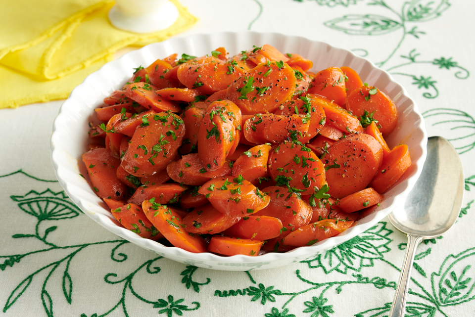 candied carrots with parsley in bowl