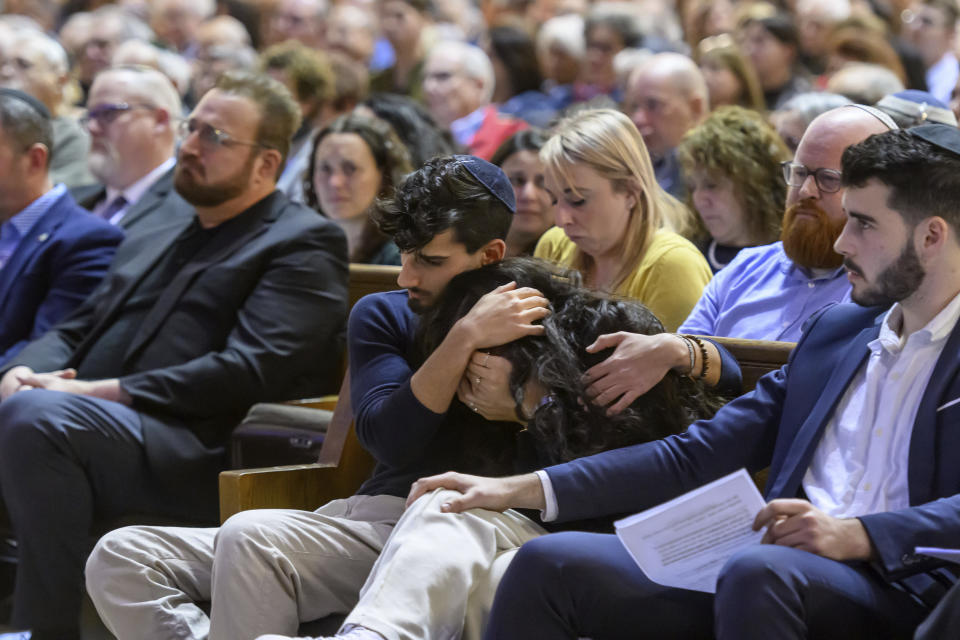 A couple embraces during a community support event at Congregation Shaarey Zedek, in Southfield, Michigan, on Oct. 9, 2023. Many top Michigan Democrats, including Gov. Gretchen Whitmer, took part in a huge pro-Israel rally near Detroit after the Hamas Oct. 7 attack in Israel, and none . None of them attended a rally in nearby Dearborn the next day to show support for Palestinians in Gaza being killed or forced from their homes by the Israeli military’s response. The war has inflamed tensions between Jews and Muslims everywhere, including the Detroit area, which is home to several heavily Jewish suburbs and Dearborn, the city with the largest concentration of Arab Americans in the U.S. (David Guralnick/Detroit News via AP)