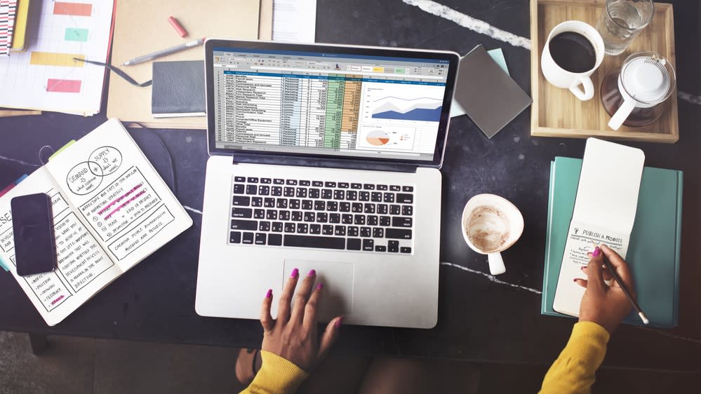  Woman working on spreadsheet. 