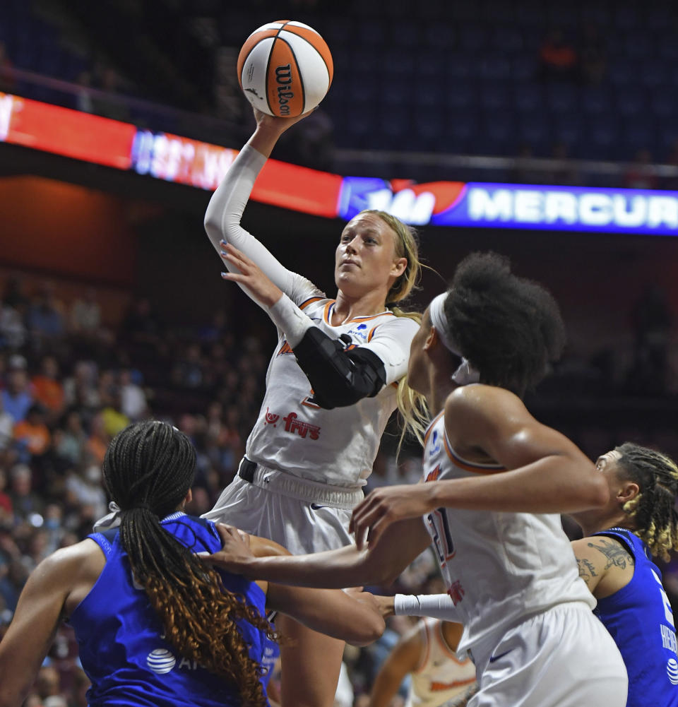 Phoenix Mercury guard Sophie Cunningham (9) shoots against the Connecticut Sun during a WNBA basketball game Tuesday, Aug. 2, 2022, in Uncasville, Conn. (Sean D. Elliot/The Day via AP)