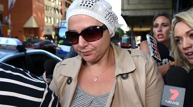 Amirah Droudis, the partner of Sydney siege cafe gunman Man Haron Monis, is surrounded by the media as she arrives at court for a bail review hearing. Photo: AAP