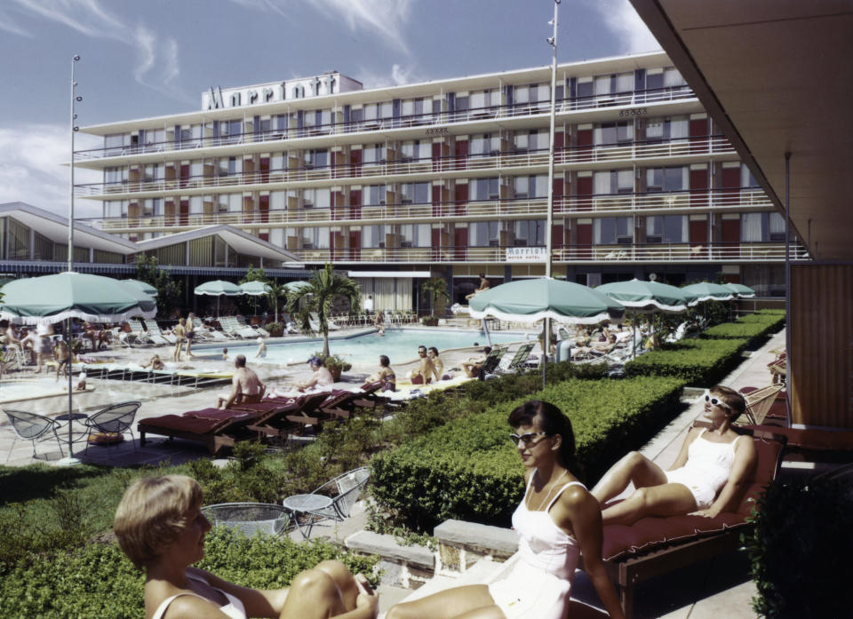 This undated photo provided by Marriott International Inc., shows the swimming pool at the Twin Bridges Marriott, in Arlington Va. In 1957, John Willard Marriott and Alice Sheets Marriott opened their first hotel _ the Twin Bridges Motor Hotel in Arlington, Va. But it was their son Bill who transformed the company into a global hotel giant. Today there are 3,718 Marriott hotels in 73 countries. The company’s other businesses have been sold.. (AP Photo/Marriott International Inc.)