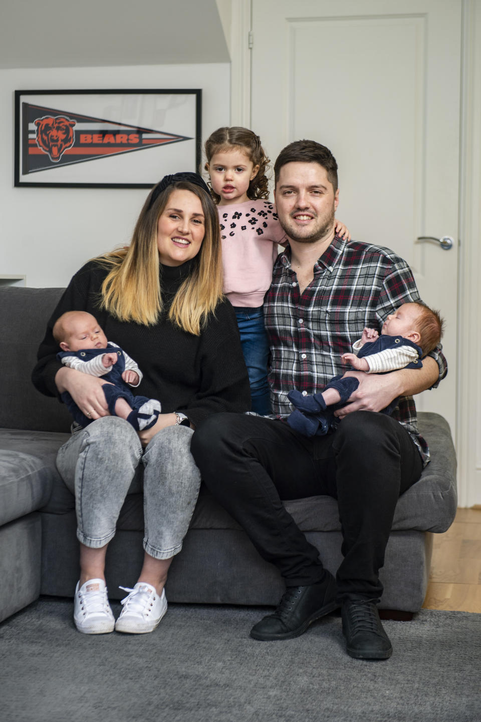 Parents Jess and Chris Chelin, holding twins Albert (left) and Eric, with their daughter Ayda, two. (SWNS)