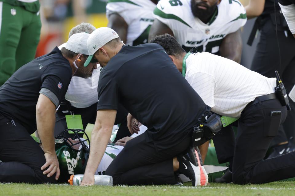 New York Jets' Mike White is injured during the second half of a preseason NFL football game against the Green Bay Packers Saturday, Aug. 21, 2021, in Green Bay, Wis. (AP Photo/Matt Ludtke)