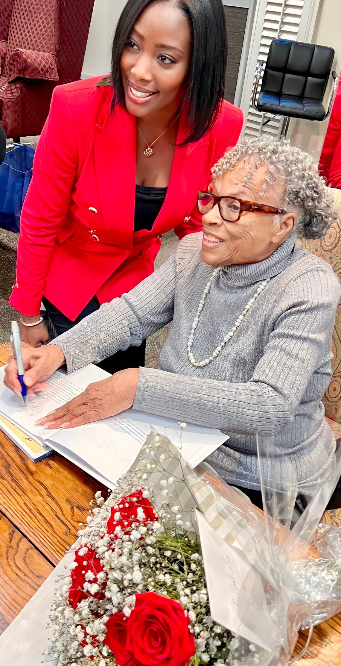 Opal Lee signed her book “Juneteenth: A Children’s Story” for Jessica Smith at a retired teachers’ luncheon March 14, 2023, at Broadway Baptist Church in Fort Worth.