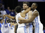North Carolina forward Luke Maye, center, celebrates with teammates after shooting the winning basket in the second half of the South Regional final game against Kentucky in the NCAA college basketball tournament Sunday, March 26, 2017, in Memphis, Tenn. The basket gave North Carolina a 75-73 win. (AP Photo/Mark Humphrey)
