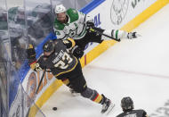 Dallas Stars' Blake Comeau (15) is checked by Vegas Golden Knights' Alec Martinez (23) during the first period of Game 2 of the NHL hockey Western Conference final, Tuesday, Sept. 8, 2020, in Edmonton, Alberta. (Jason Franson/The Canadian Press via AP)