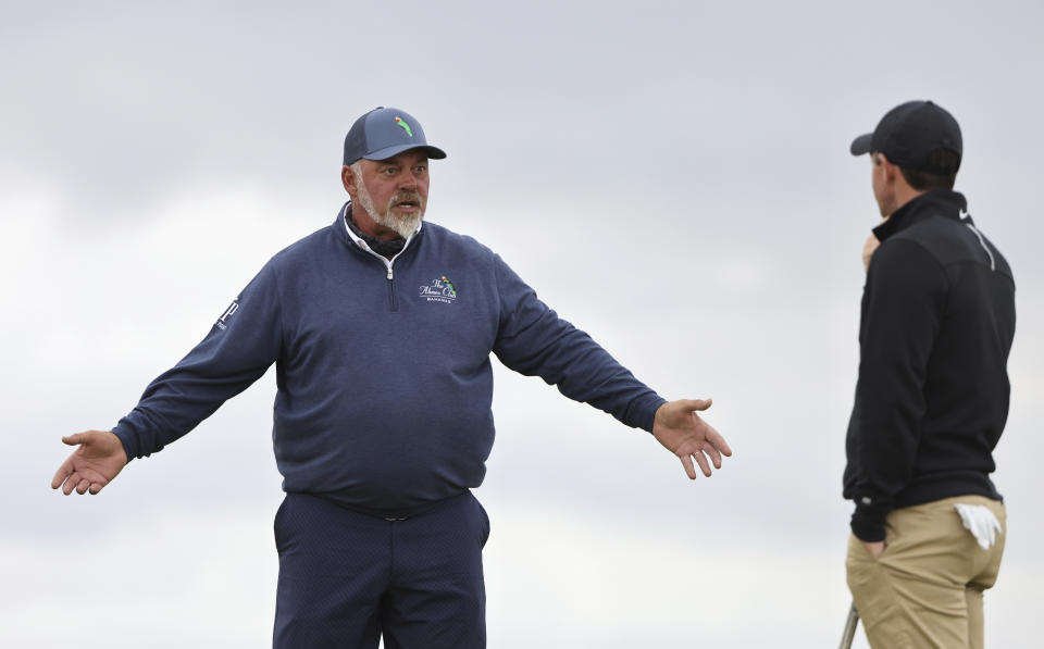 Northern Ireland's Rory McIlroy, right talks to Northern Ireland's Darren Clarke on the 10th hole during a practice round for the British Open Golf Championship at Royal St George's golf course Sandwich, England, Wednesday, July 14, 2021. The Open starts Thursday, July, 15. (AP Photo/Ian Walton)