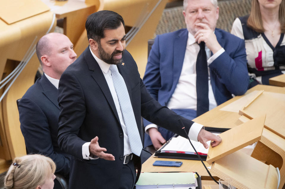 Scotland's First Minister Humza Yousaf speaks during First Minster's Questions (FMQ's) at the Scottish Parliament in Holyrood, Edinburgh, Thursday April 25, 2024. The Scottish National Party has ended its three-year power-sharing agreement with the much smaller Greens after tensions grew between the two pro-independence parties over climate change policies. Humza Yousaf, Scotland’s first minister, informed the Greens on Thursday he was terminating the agreement with immediate effect. (Lesley Martin/PA via AP)