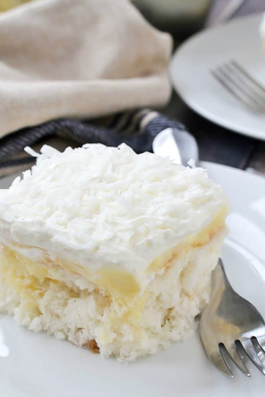 <p><strong>Coconut Poke Cake</strong></p><p>Get the recipe <a href="http://www.motherthyme.com/2017/04/coconut-cream-poke-cake.html/" rel="nofollow noopener" target="_blank" data-ylk="slk:here;elm:context_link;itc:0;sec:content-canvas" class="link rapid-noclick-resp"><em><strong>here</strong></em></a></p>