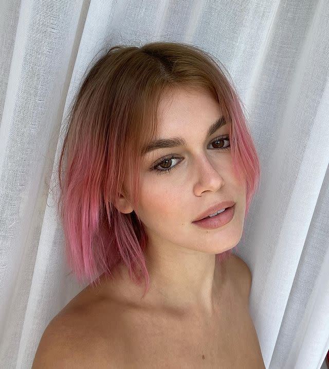 <p>Having dyed her hair in stages from her natural brunette, through caramel, and finally to bleached blonde, Kaia Gerber finally arrived at her destination: bubblegum pink. The teen model turned to the expertise of backstage hair pro Guido Palau who guided Gerber through the entire process via Zoom.</p><p><a href="https://www.instagram.com/p/CEDD1pJDzHP/" rel="nofollow noopener" target="_blank" data-ylk="slk:See the original post on Instagram;elm:context_link;itc:0;sec:content-canvas" class="link ">See the original post on Instagram</a></p>