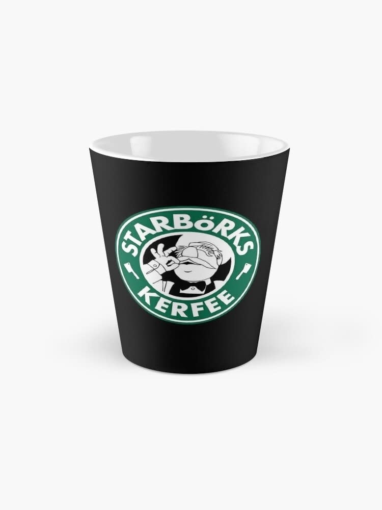 A novelty cup with a parody logo that reads "Starborks Kerfee" featuring a Muppet's face