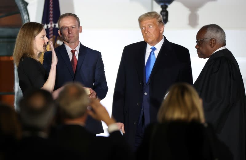 Judge Amy Coney is sworn in as an associate justice of the U.S. Supreme Court at the White House in Washington