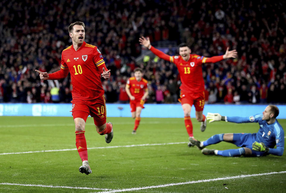 Wales' Aaron Ramsey celebrates scoring his side's first goal of the game against Hungary during their UEFA Euro 2020 Qualifying soccer match at the Cardiff City Stadium, in Cardiff, Wales, Tuesday Nov. 19, 2019. (Nick Potts/PA via AP)