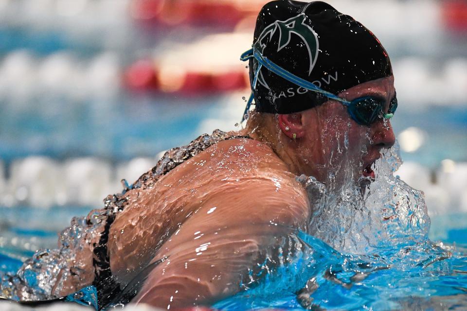 Fossil Ridge swimmer Kenadie Glasgow rises from the water during the 100-yard breaststroke at the Colorado Girls 5A State Championships in Thornton on Friday.
