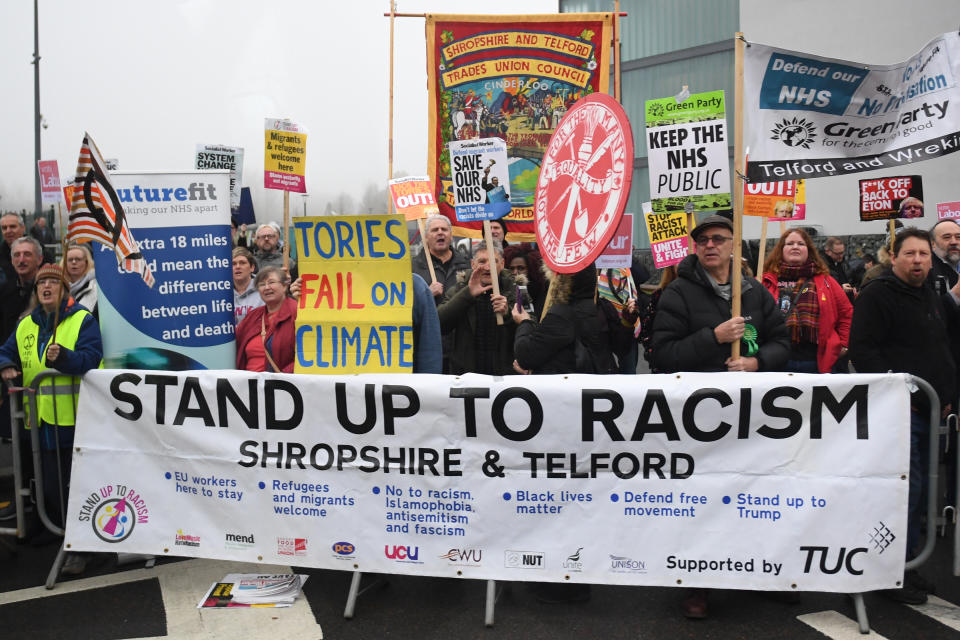 Protesters wait for the arrival of Prime Minister Boris Johnson ahead of the launch of his party's manifesto at Telford International Centre in Telford, West Midlands.