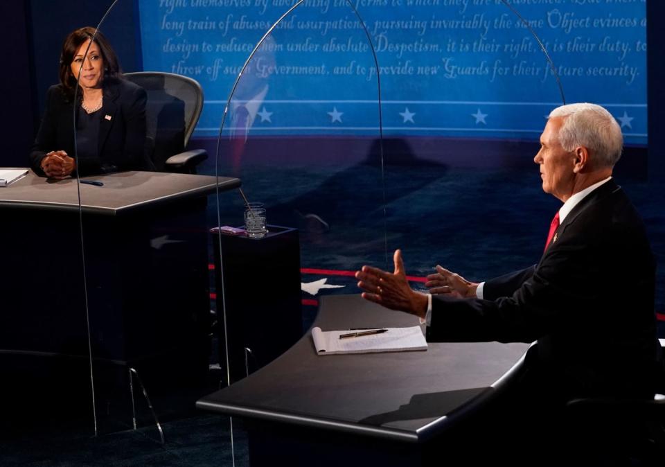 Mike Pence gestures as he speaks on stage