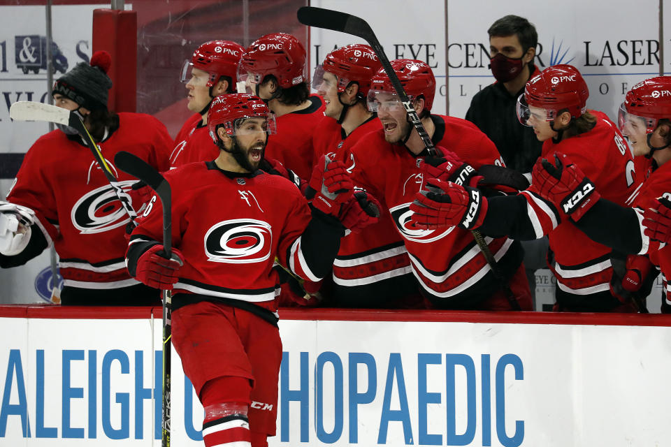 Carolina Hurricanes' Vincent Trocheck (16) celebrates his goal with teammates during the shootout of an NHL hockey game against the Dallas Stars in Raleigh, N.C., Sunday, Jan. 31, 2021. (AP Photo/Karl B DeBlaker)