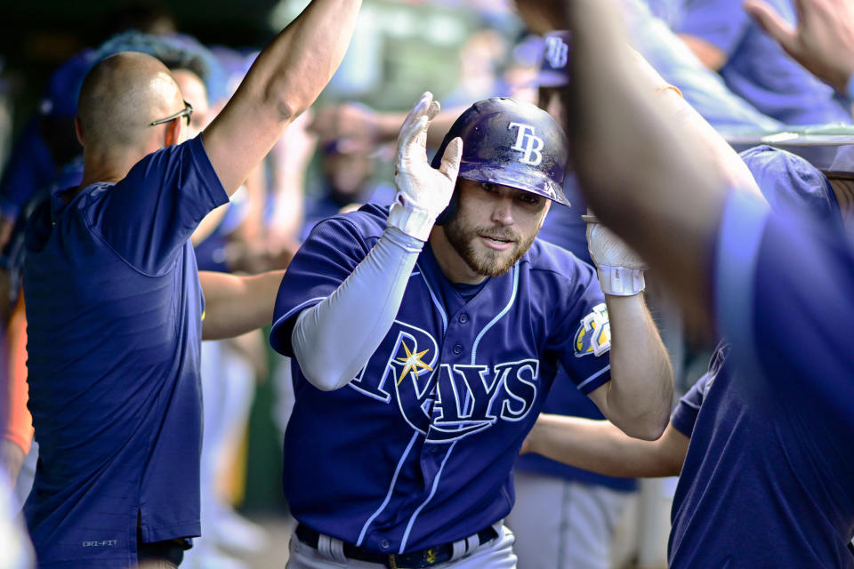 Tampa Bay Rays Brandon Lowe (8) celebrates in the dugout with teammates after his two run home run in the seventh inning of a baseball game against the Chicago Cubs on Wednesday, May 31, 2023, in Chicago. (AP Photo/Quinn Harris)