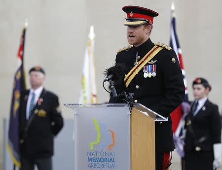 Britain's Prince Harry speaks after laying a wreath on the Armed Forces Memorial during Armistice Day commemorations at the National Memorial Arboretum in Alrewas, Britain, November 11, 2016. REUTERS/Darren Staples