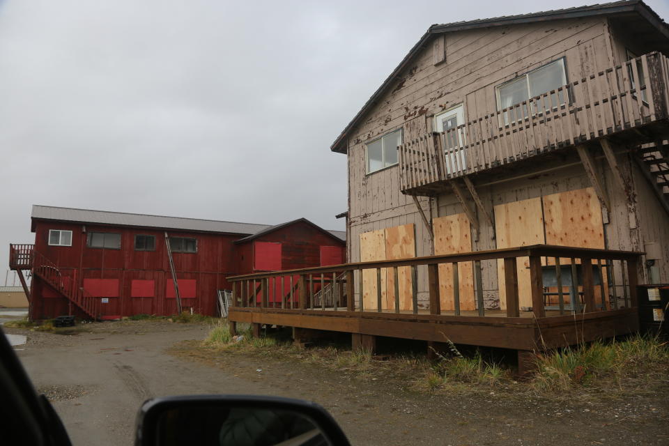 Windows have been boarded up on a motel and restaurant near the Bering Sea in Nome, Alaska, on Friday, Sept. 16, 2022. Much of Alaska's western coast could see flooding and high winds as the remnants of Typhoon Merbok moved into the Bering Sea region. The National Weather Service says some locations could experience the worst coastal flooding in 50 years. (AP Photo/Peggy Fagerstrom)