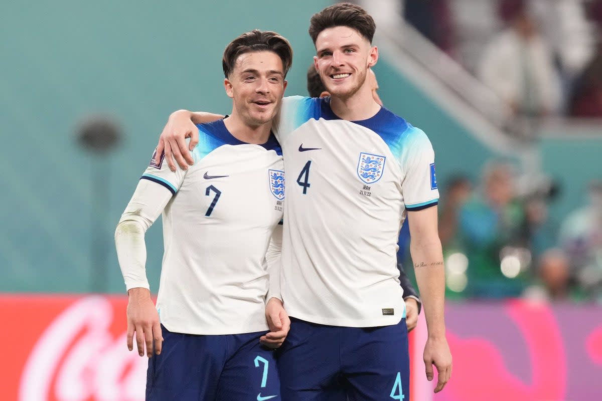 Jack Grealish (left) celebrates with Declan Rice after England’s win over Iran (Martin Rickett/PA) (PA Wire)