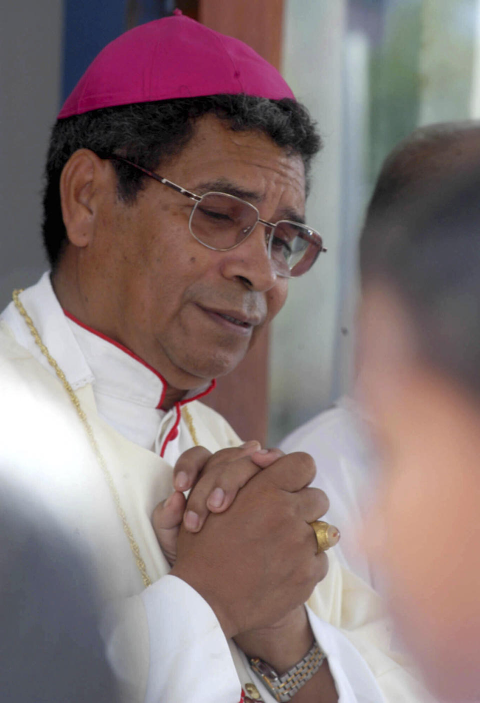 FILE - East Timor's Roman Catholic Bishop Carlos Ximenes Belo leads a Mass in Baucau hospital, 128 kilometers (80 miles) east of the capital Dili, East Timor, on July 26, 2003. Belo has been accused in a Dutch magazine article of sexually abusing boys in East Timor in the 1990s, rocking the Catholic Church in the impoverished nation and forcing officials at the Vatican and his religious order to scramble to provide answers. (AP Photo/Firdia Lisnawati, File)