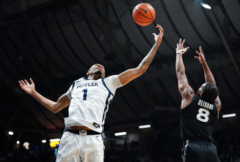 Mar 6, 2024; Indianapolis, Indiana, USA; Butler Bulldogs forward Jalen Thomas (1) rebounds the ball against Xavier Musketeers guard Quincy Olivari (8) during the first half at Hinkle Fieldhouse.