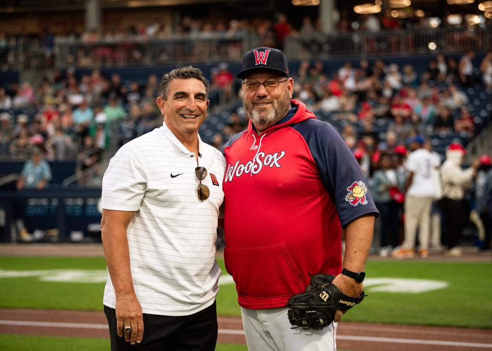 Former St. Peter-Marian baseball teammates J.P. Ricciardi, left, and RIch Gedman pose for a picture after Gedman caught Ricciardi's ceremonial first pitch before a WooSox game last August.