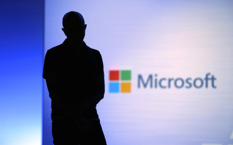 FILE- In this May 7, 2018, file photo Microsoft CEO Satya Nadella looks on during a video as he delivers the keynote address at Build, the company&#39;s annual conference for software developers in Seattle. Microsoft is requesting the Federal Election Commission&#39;s advisory opinion to make sure Microsoft&#39;s new free package of online account security protections for 