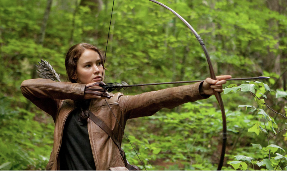 katniss holding a bow and arrow