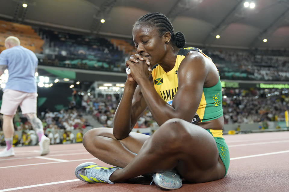 Danielle Williams, of Jamaica, reacts after winning the gold medal in the women's 100-meters hurdles final during the World Athletics Championships in Budapest, Hungary, Thursday, Aug. 24, 2023. (AP Photo/Matthias Schrader)