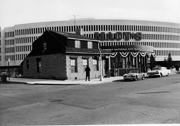 1966 Elmhurst, N.Y.: The home of real estate holdout Mary Sendek in Elmhurst, Queens, New York is pictured on January 11, 1966. Sendek refused to sell the house at 87-01 Queens Boulevard to Macy's Department store despite an offer of $200,000 for the building. Macy's was forced to design the new store around the home. (Photo by Rex Lyons/Newsday RM via Getty Images)