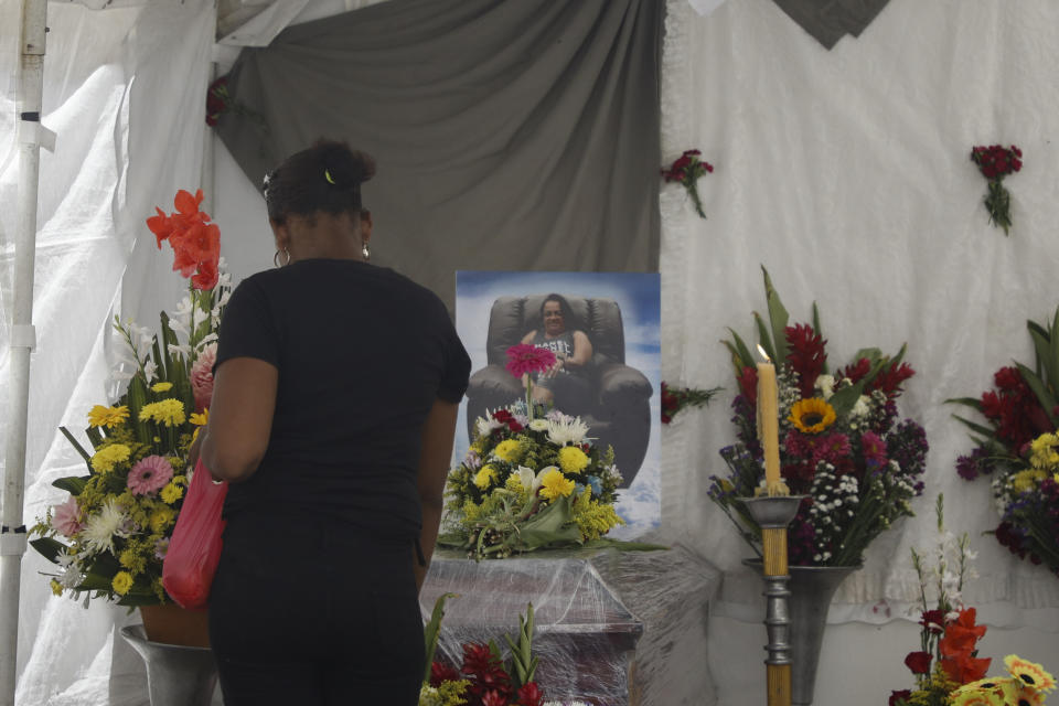 A person attends the wake of Maribel Euseda in Tegucigalpa, Honduras, Thursday, June 22, 2023. Euseda and her daughter Karla died in a riot on June 20 at a women's prison northwest of the Honduran capital that killed at least 46 inmates, many of them burned, shot or stabbed to death, according to police. (AP Photo/Elmer Martinez)