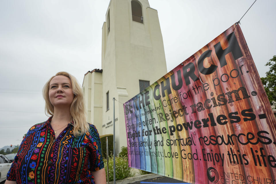 Pastor Ruth Schmidt poses for a picture at the Altadena Community Church in Altadena, Calif., on Tuesday, May 21, 2024. Schmidt, who now serves as a pastor at Claremont Presbyterian Church and is on track to be ordained in the United Church of Christ, said she would like to see faculty and staff at Fuller get the same protections as students. Fuller Theological Seminary, an evangelical school is deliberating whether to become more open to LGBTQ+ students who previously faced possible expulsion if found to be in a same-sex union. (AP Photo/Damian Dovarganes)