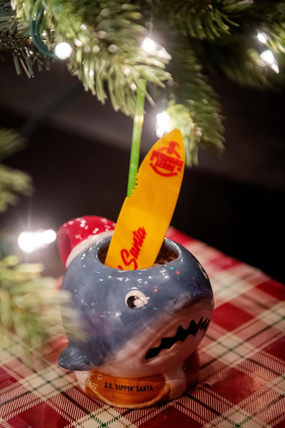 The Sharkey’s First Christmas cocktail is made with vodka, aquavit, melon and walnut liqueurs, and lime and pineapple juices.